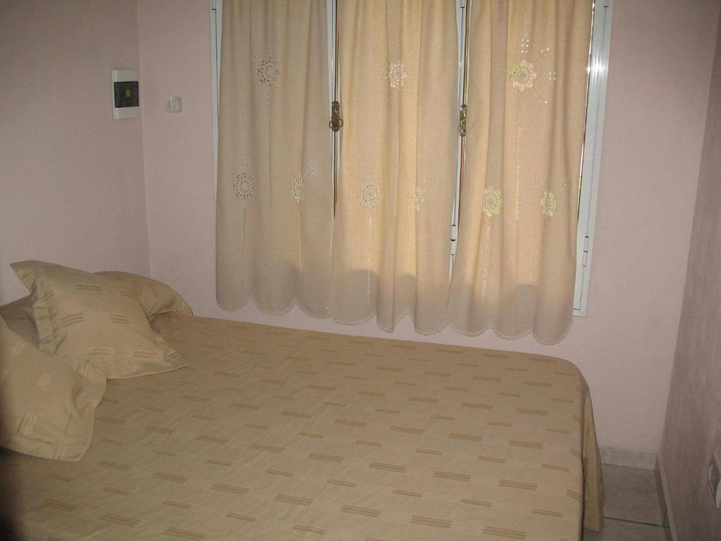Una cama o camas en una habitación de Locaciones Colon