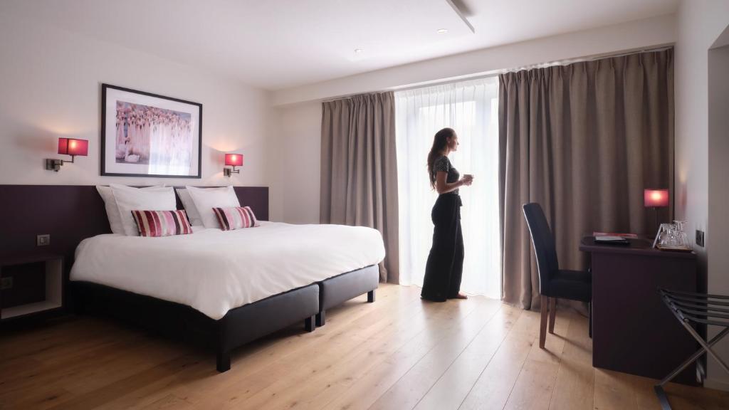 Postel nebo postele na pokoji v ubytování Le 24 Hotel