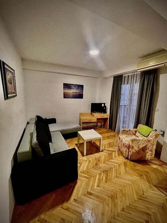 a living room with a couch and a table at DARTAD APARTMENT in Ohrid