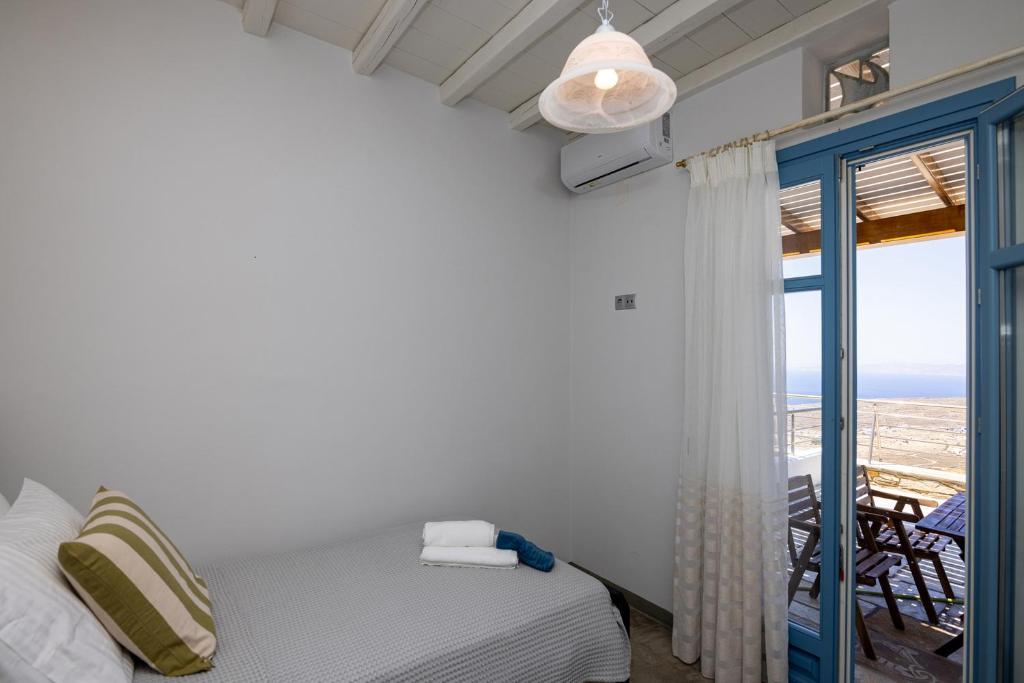 Postel nebo postele na pokoji v ubytování Aegean Muses