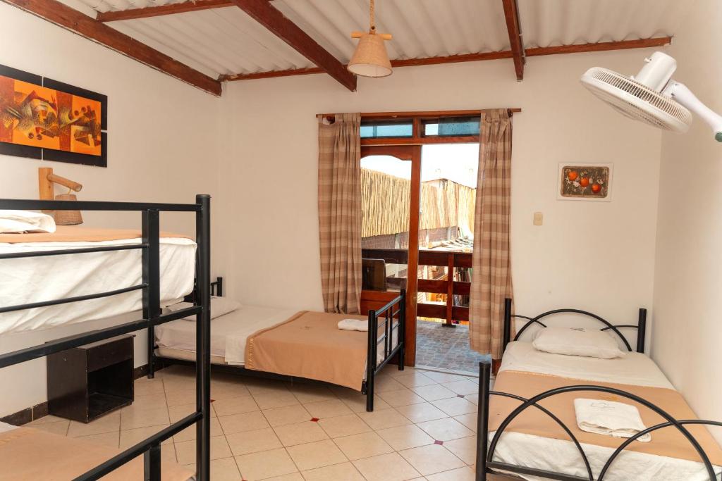 Postel nebo postele na pokoji v ubytování Hotel Luna Nueva