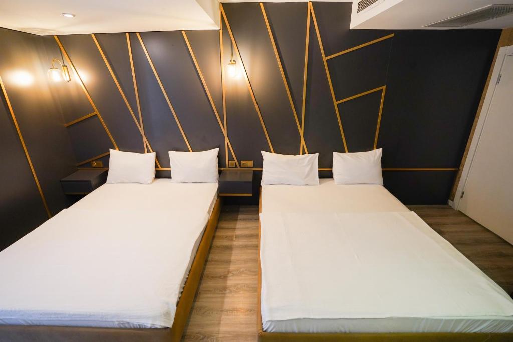 A bed or beds in a room at Time Hotel Mecidiyekoy