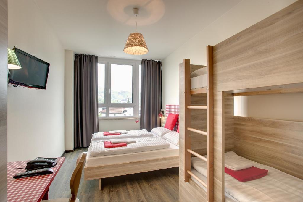 Cama o camas de una habitación en MEININGER Hotel Salzburg City Center