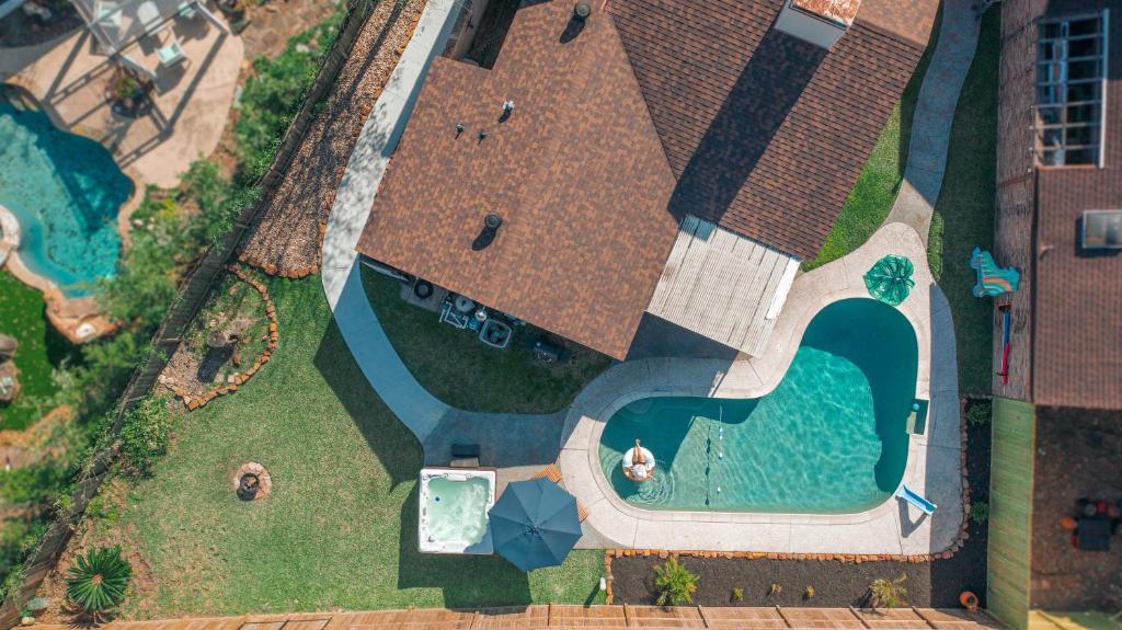 an overhead view of a house with a swimming pool at 1976 HoustonGem Luminous Pool & HotTub sleeps11 in Houston