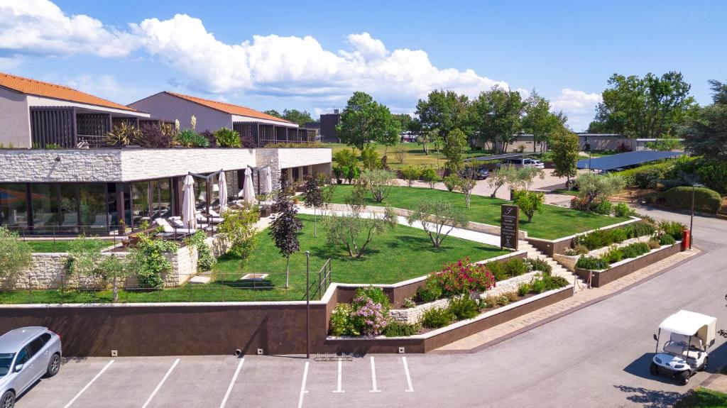 an aerial view of a garden in front of a building at San Servolo Wellness Resort - Adults Only in Buje