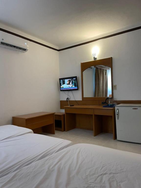 Postel nebo postele na pokoji v ubytování Mashrabiya Hotel