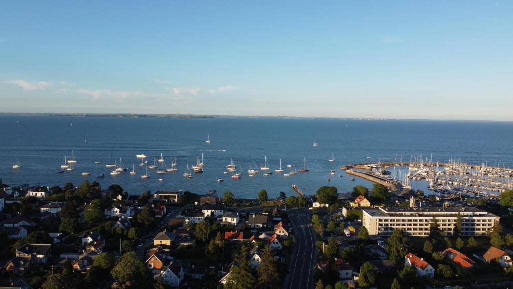 a view of a harbor with boats in the water at Annex near beach close to Copenhagen in Vedbæk