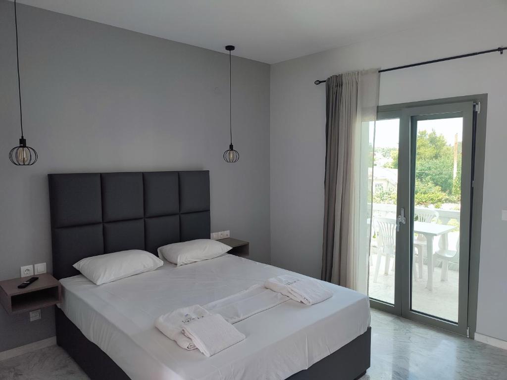 Postel nebo postele na pokoji v ubytování Hotel Paraktio