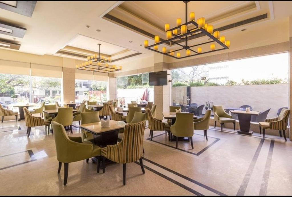 A restaurant or other place to eat at Madhuban Hotel , New delhi