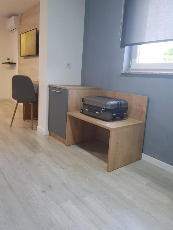 Televízia a/alebo spoločenská miestnosť v ubytovaní Rooms Vanteo