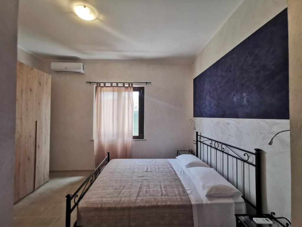 Łóżko lub łóżka w pokoju w obiekcie Villa Bianca