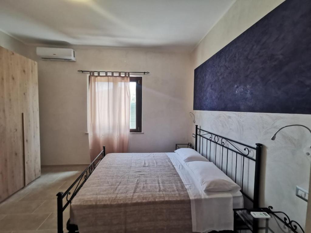 Łóżko lub łóżka w pokoju w obiekcie Villa Bianca