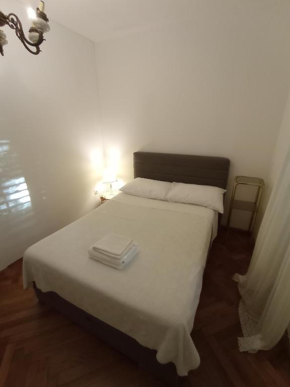 Postel nebo postele na pokoji v ubytování Damjan Rooms