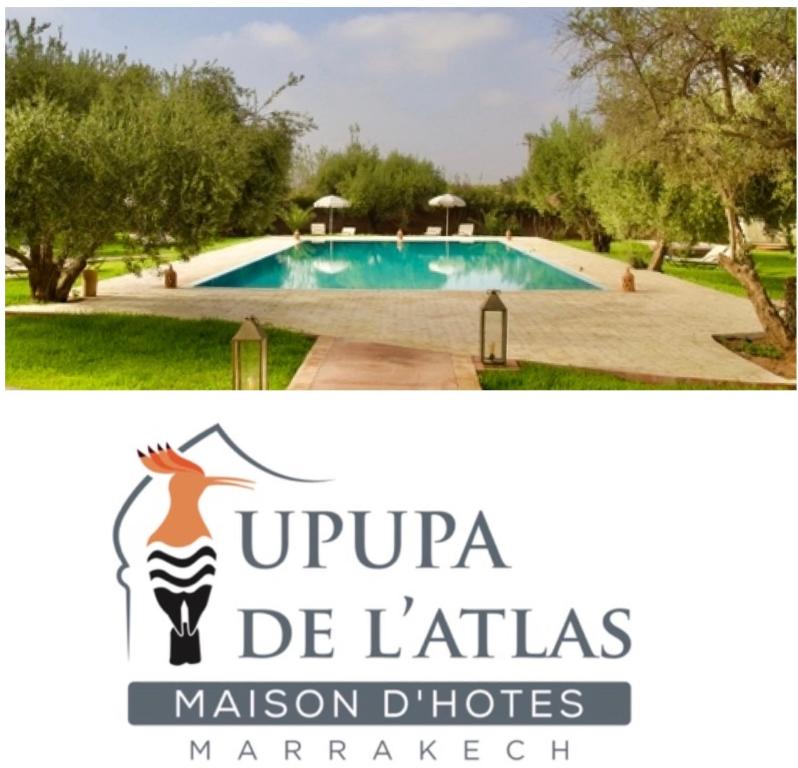 un cartello per una villa con piscina di Upupa de l’Atlas a Marrakech