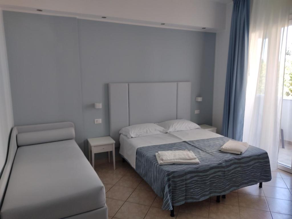 Postel nebo postele na pokoji v ubytování Hotel Caravel Park