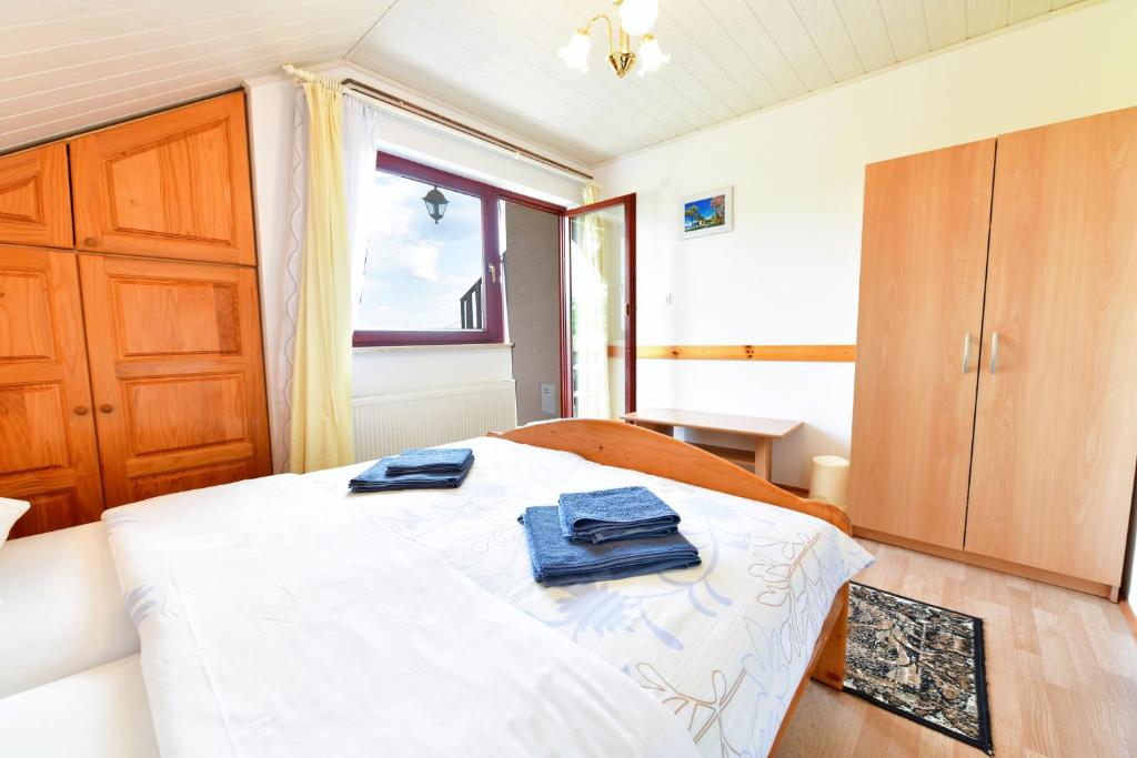 Posteľ alebo postele v izbe v ubytovaní Guesthouse Ante Hodak