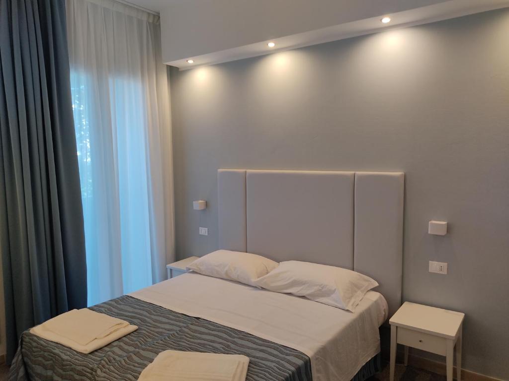 Postel nebo postele na pokoji v ubytování Hotel Caravel Park