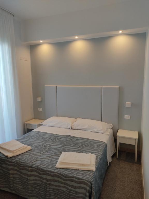 Postel nebo postele na pokoji v ubytování Hotel Caravel Park