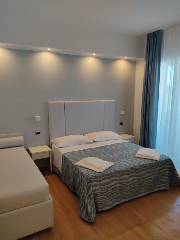 Postel nebo postele na pokoji v ubytování Hotel Caravel Park