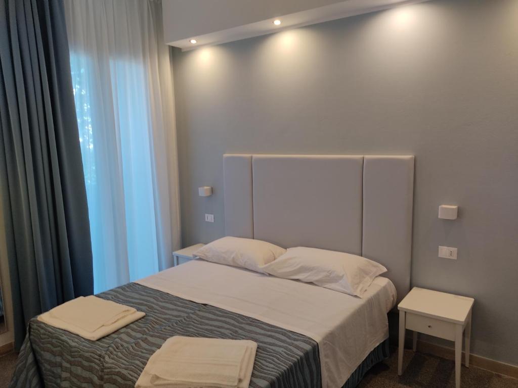 Postel nebo postele na pokoji v ubytování Hotel Caravel Park