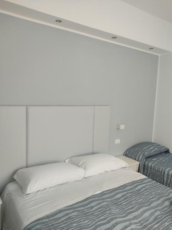 Postel nebo postele na pokoji v ubytování Hotel Caravel Park
