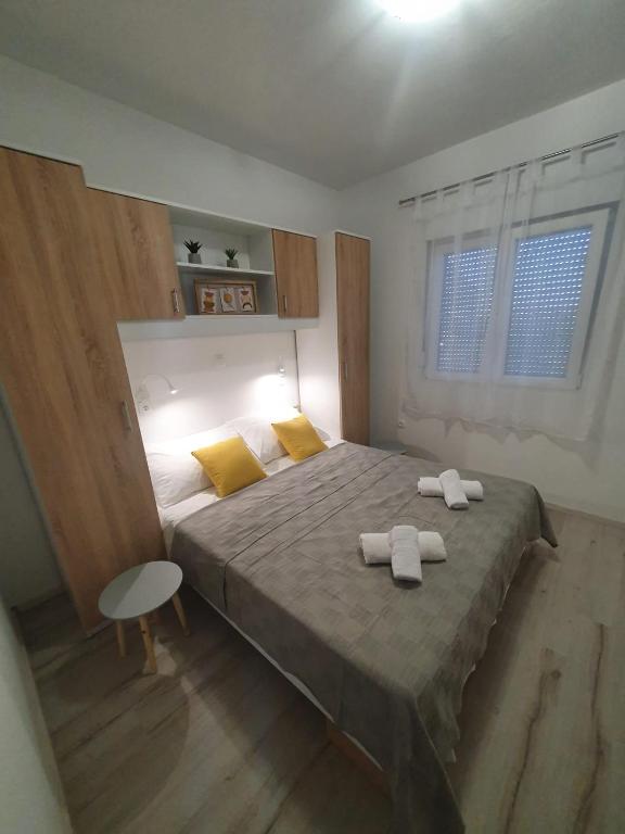 Posteľ alebo postele v izbe v ubytovaní Apartments MENA