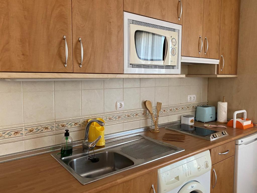 A kitchen or kitchenette at APARTAMENTOS MATEO