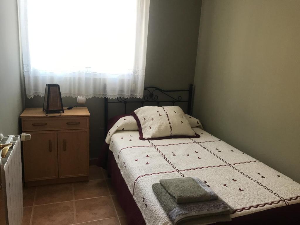 A bed or beds in a room at APARTAMENTOS MATEO