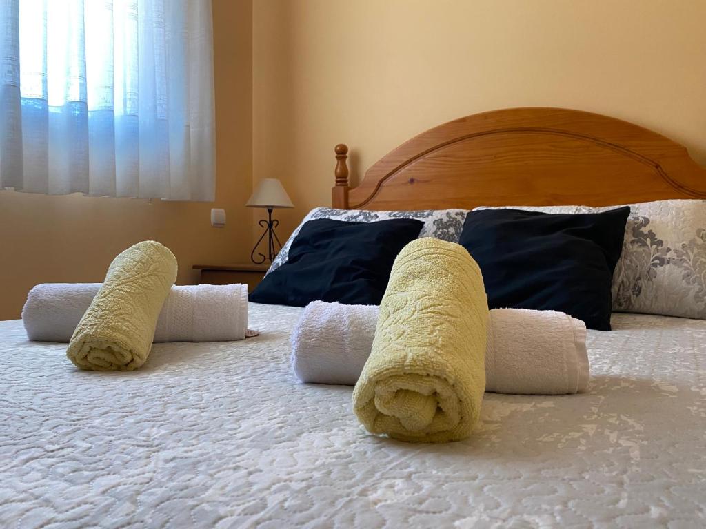 A bed or beds in a room at APARTAMENTOS MATEO