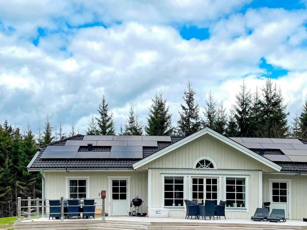 a house with solar panels on the roof at Holiday home ULRICEHAMN IV in Ulricehamn