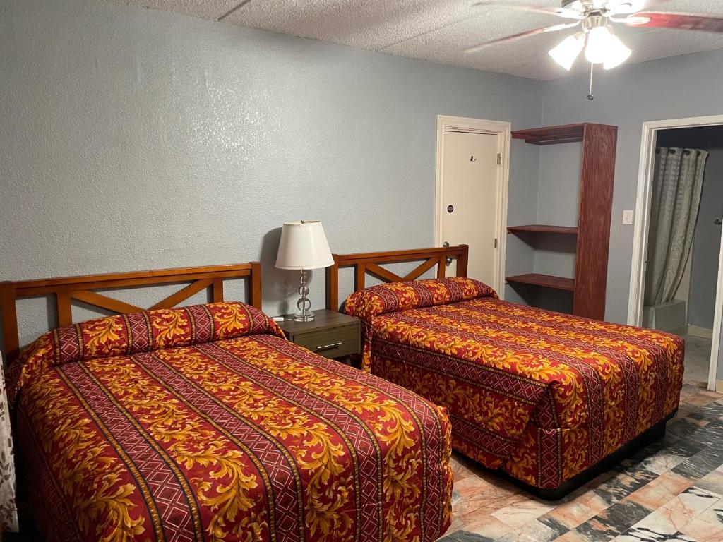Postel nebo postele na pokoji v ubytování Southwind Inn