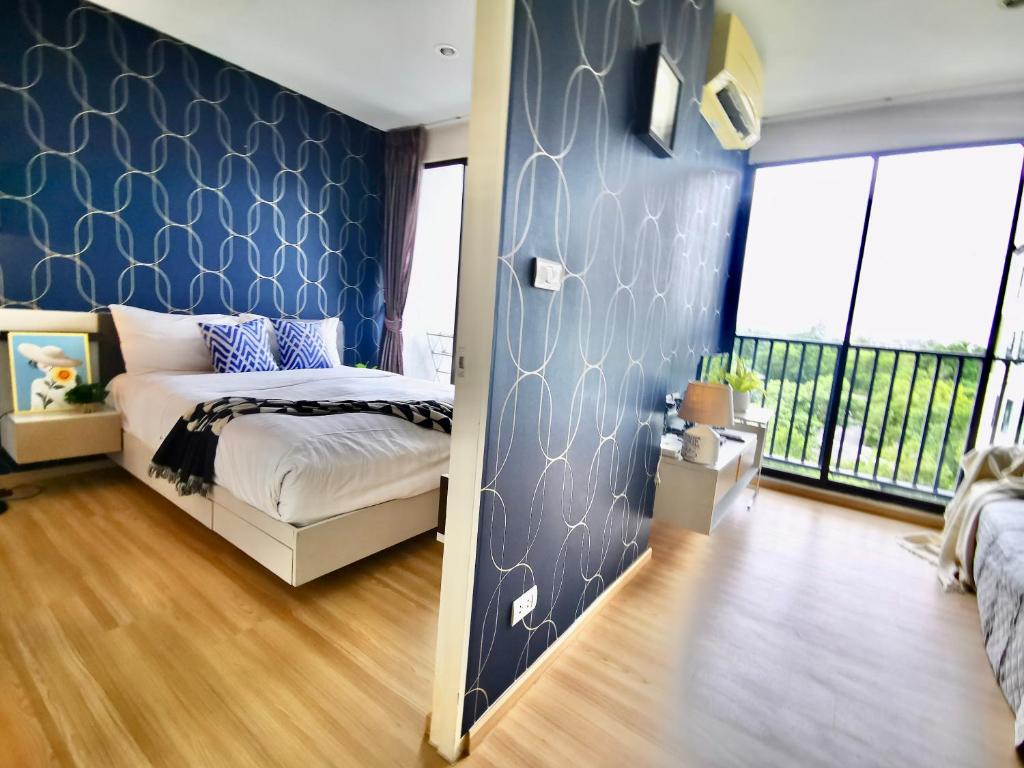 Кровать или кровати в номере Bangtao,Layan beach apartment