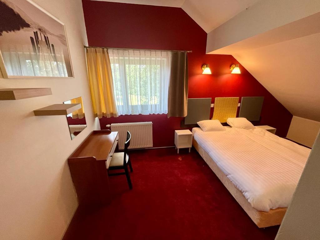 Postel nebo postele na pokoji v ubytování Apartamenty Residence Borkowo