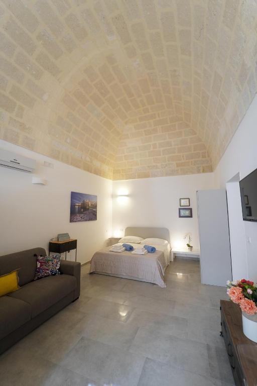 Postel nebo postele na pokoji v ubytování Ailanthus Holiday Suites