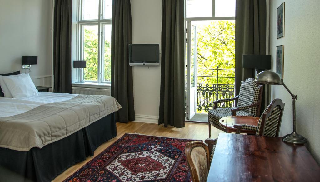 Postel nebo postele na pokoji v ubytování Hotell Linnéa - Helsingborg