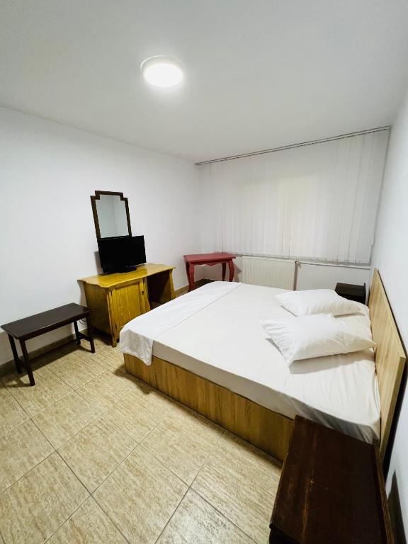 Postel nebo postele na pokoji v ubytování Hostel Bistrița