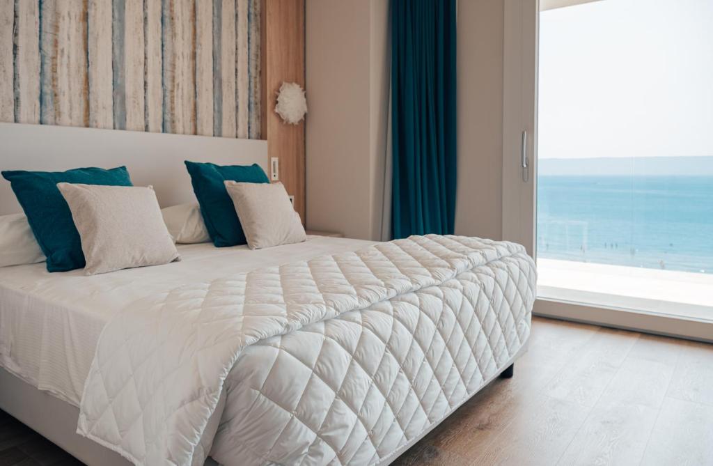 Postel nebo postele na pokoji v ubytování Hotel Galassia Suites & Spa