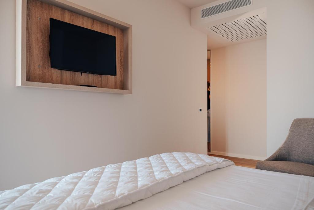 Postel nebo postele na pokoji v ubytování Hotel Galassia Suites & Spa