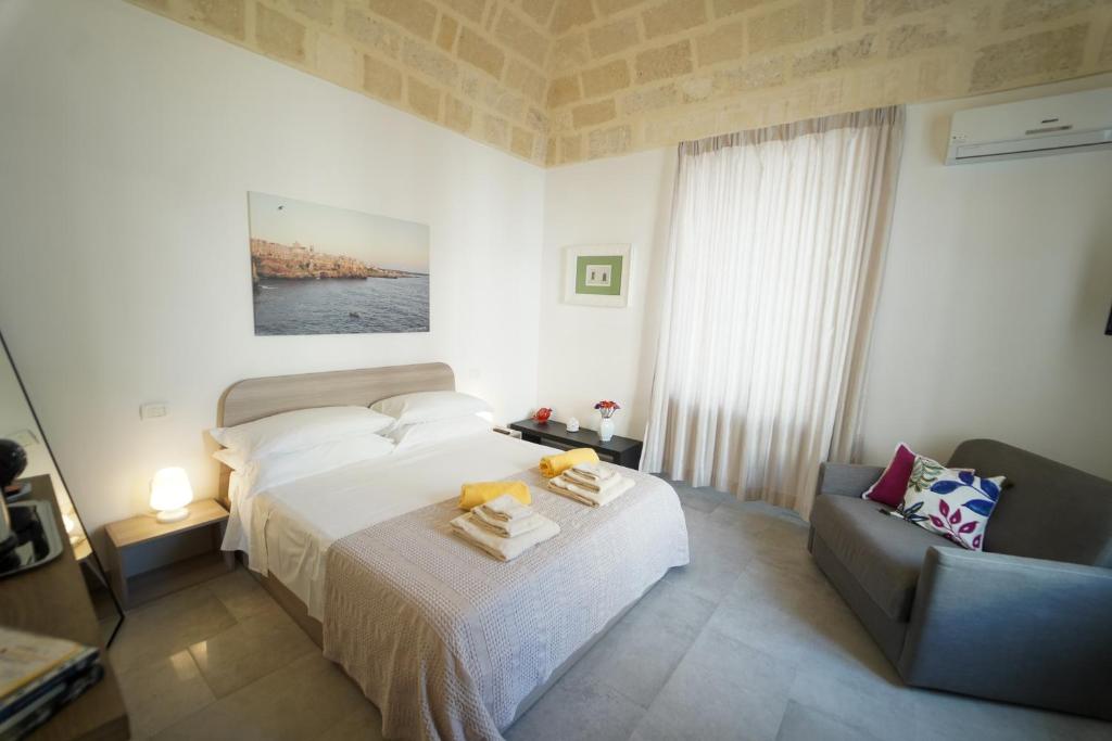 Postel nebo postele na pokoji v ubytování Ailanthus Holiday Suites
