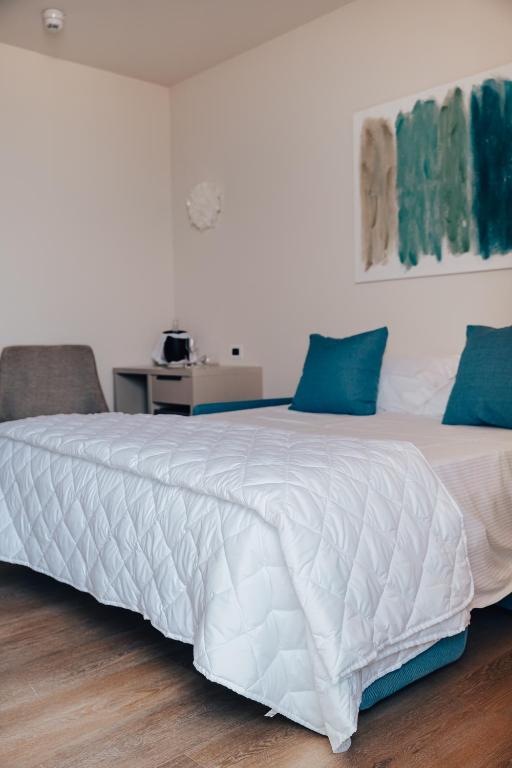 Postel nebo postele na pokoji v ubytování Hotel Galassia Suites & Spa