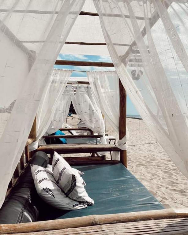 Postel nebo postele na pokoji v ubytování Brazaville Beach Resort
