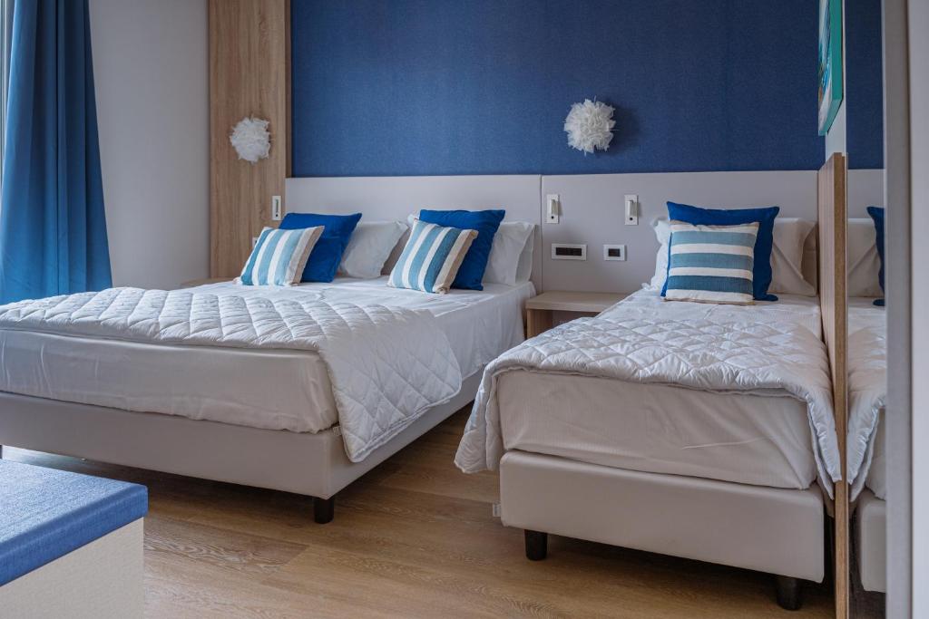 Postel nebo postele na pokoji v ubytování Hotel Galassia Suites & Spa