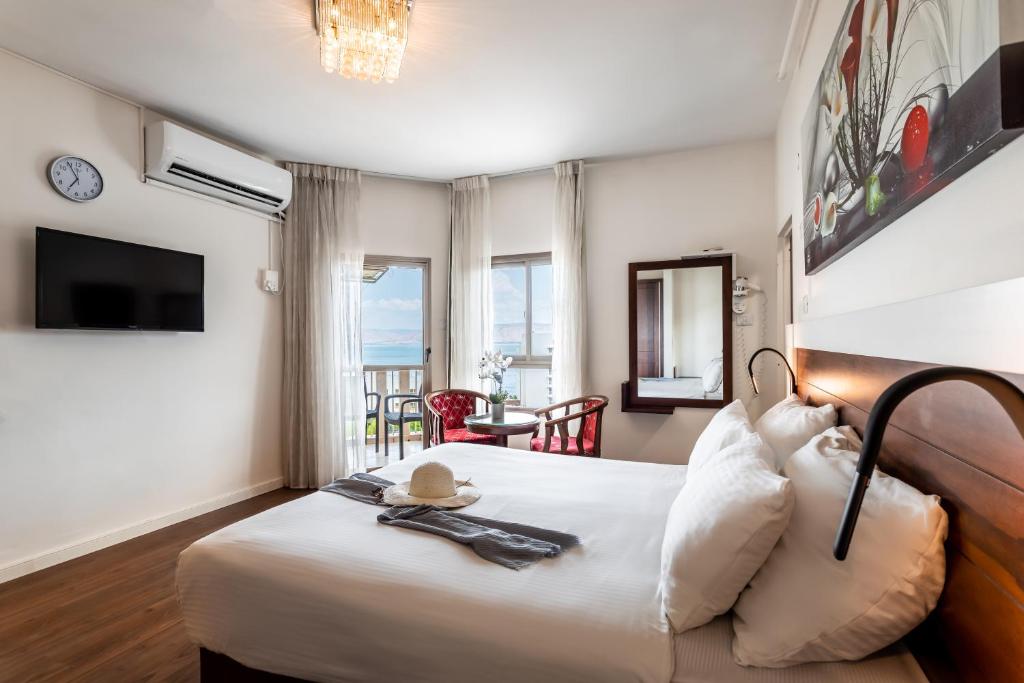 Postel nebo postele na pokoji v ubytování Aviv Holiday Flat