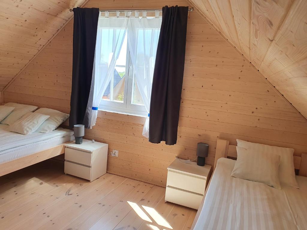 Postel nebo postele na pokoji v ubytování A&M Apartamenty