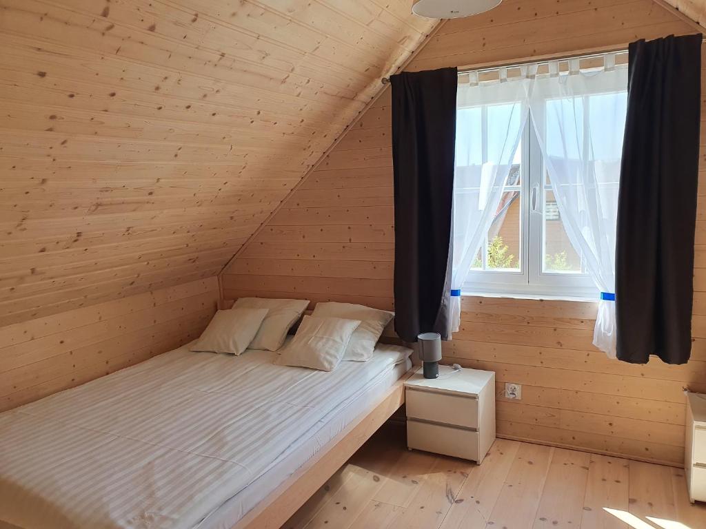 Postel nebo postele na pokoji v ubytování A&M Apartamenty