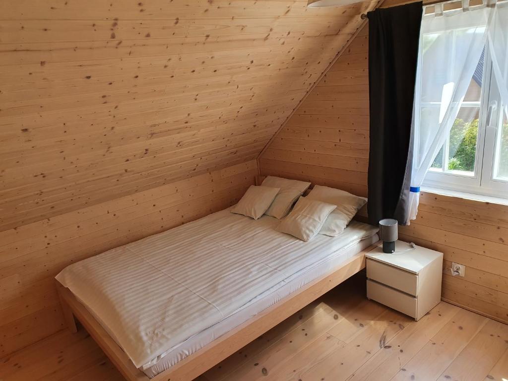 Postel nebo postele na pokoji v ubytování A&M Apartamenty