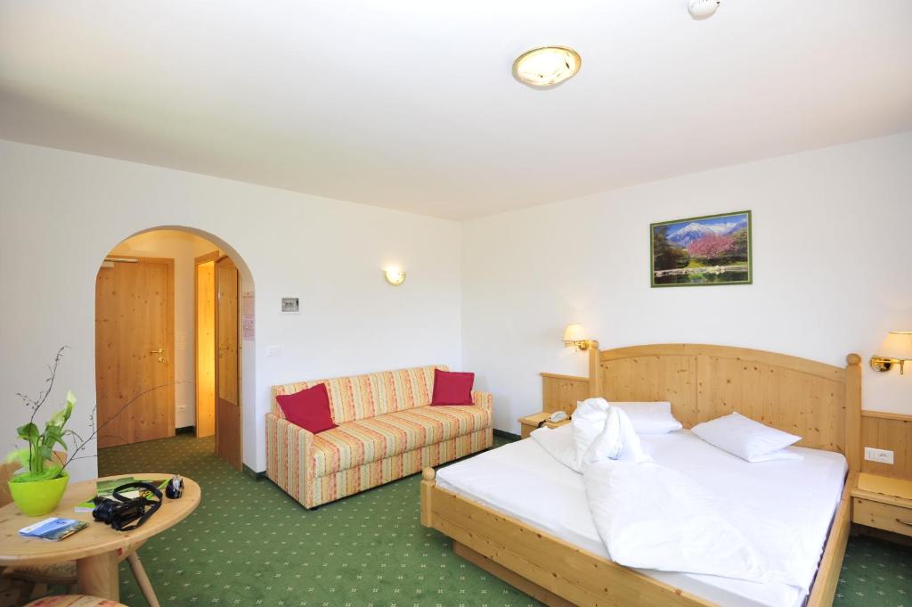 Postel nebo postele na pokoji v ubytování Hotel Weger