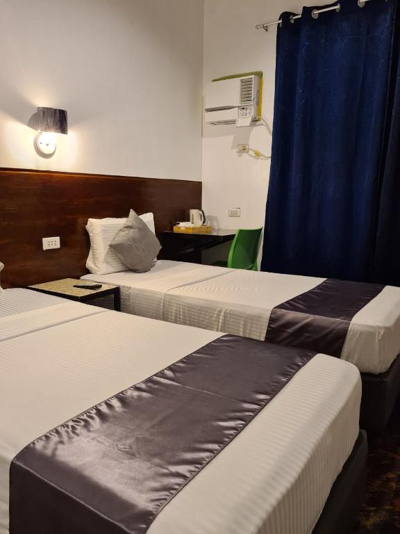 Postel nebo postele na pokoji v ubytování My Stay Hotel - Near SM Mall -1 min walk