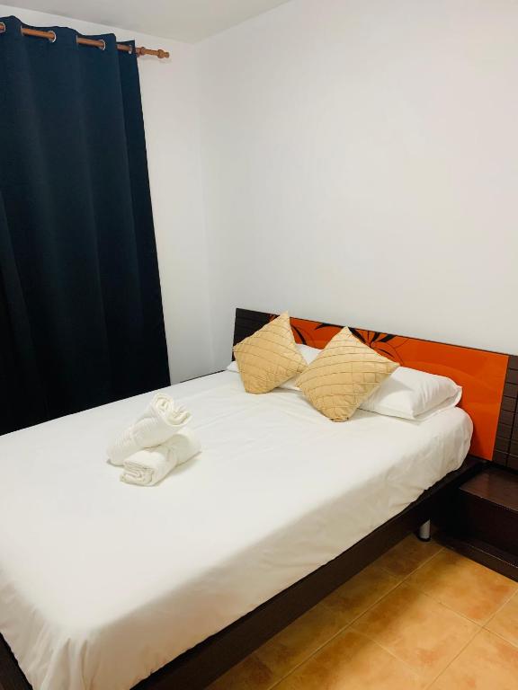 Postel nebo postele na pokoji v ubytování Lin House