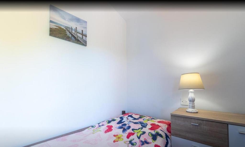 Postel nebo postele na pokoji v ubytování Apartmani Zaninović